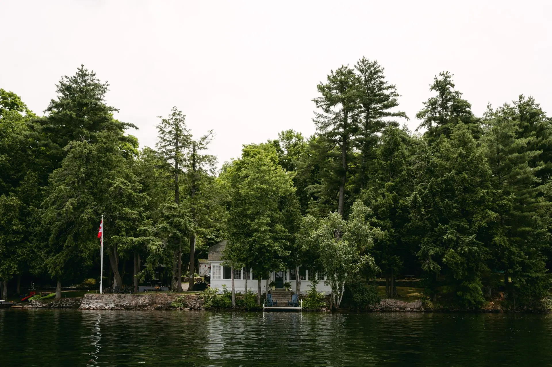 Lakeside home nestled among trees in Ontario's cottage country